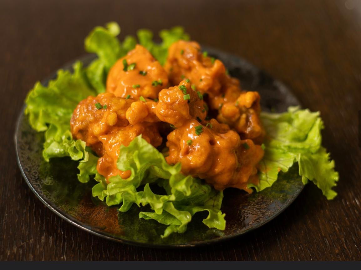 Chicken Dynamite morceaux poulet marinés frits maison sauce épicée entrée Wokys Compiègne 7€90